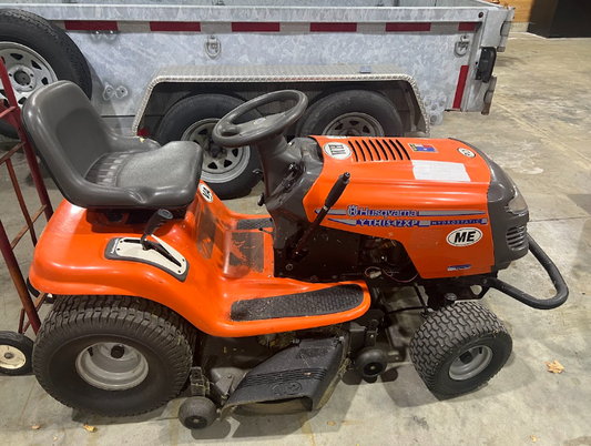 Used Orange Husqvarna YTH1542XP riding lawn tractor, 42 inch. Hydrostatic transmission.